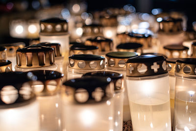 Grave candles on a cemetery on all saints eve
