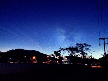 Low angle view of illuminated street light at night