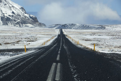 Wet and slippery road in iceland, winter