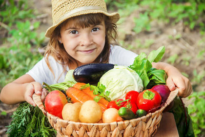 Portrait of young woman holding food