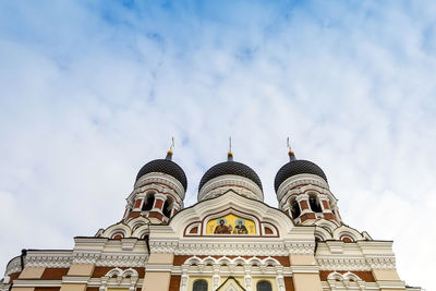 Low angle view of cathedral against cloudy sky