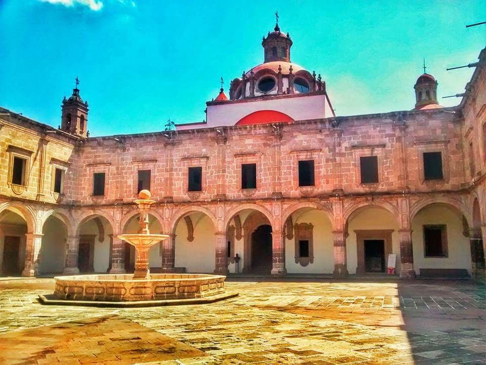 architecture, built structure, building exterior, arch, place of worship, dome, facade, religion, church, spirituality, sky, blue, travel destinations, water, day, clear sky, sunlight, outdoors