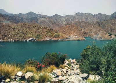 Scenic view of lake against mountain range