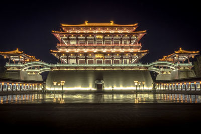 Illuminated traditional building against sky at tang paradise