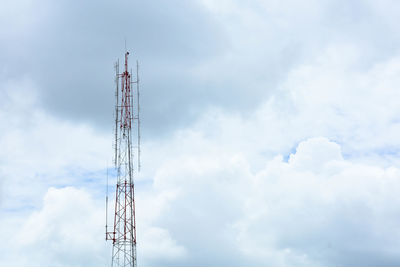 Low angle view of communications tower against sky