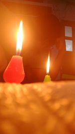 Close-up of illuminated tea light candles