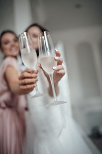 Midsection of man drinking glass