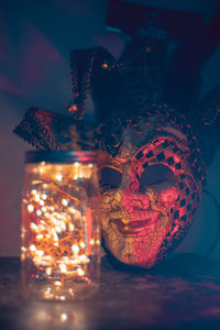Close-up of illuminated christmas decorations on table