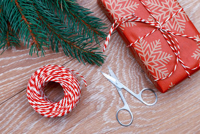 Close-up of christmas tree and gifts on table