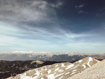 Scenic view of snowcapped mountains against sky