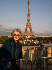 Portrait of smiling woman against eiffel tower 