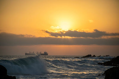 Scenic view of sea against sky during sunset