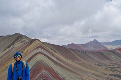 Portrait of man against mountain range