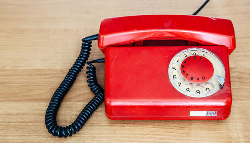 Close-up of telephone booth on table