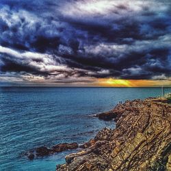 Scenic view of sea against cloudy sky