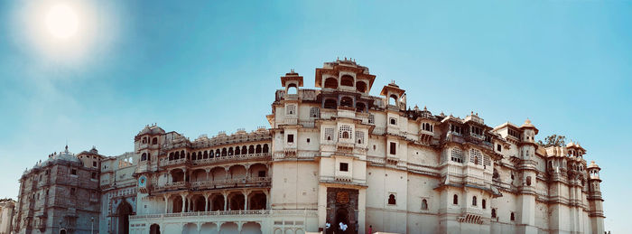 Low angle view of historic building against blue sky