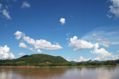 Scenic shot of calm lake against mountain range