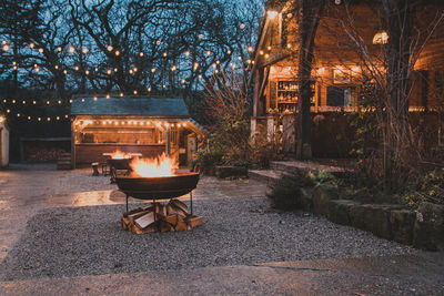 Illuminated lamp by building at night