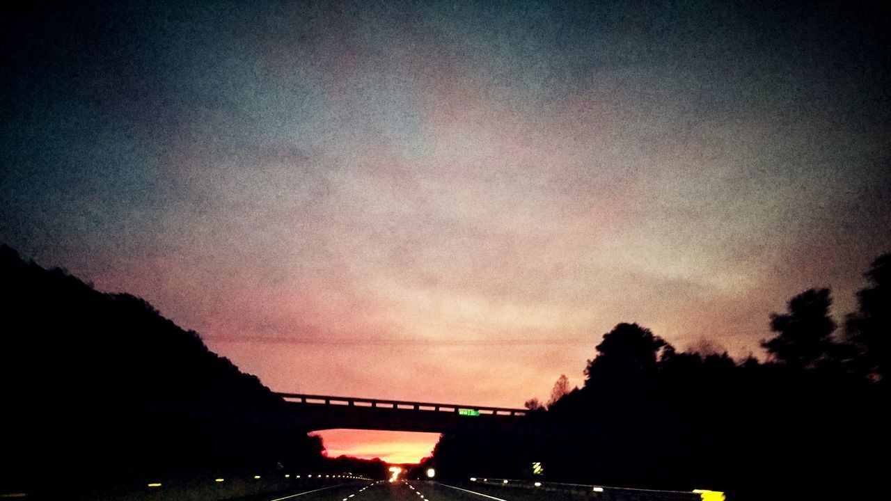 SILHOUETTE BRIDGE AGAINST SKY AT DUSK