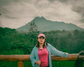 Portrait of women standing against mountain