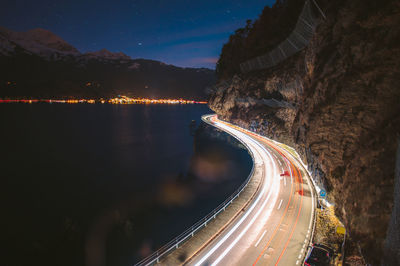 High angle view of light trails on road against sky