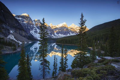 Scenic view of snowcapped mountains against sky during winter