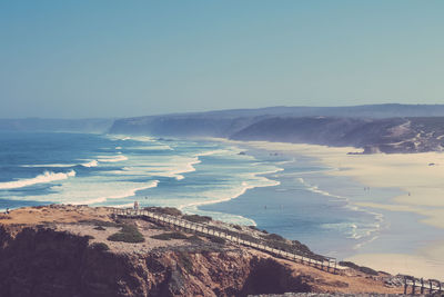 Scenic view of beach against clear sky