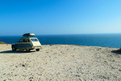 Scenic view of sea against clear blue sky