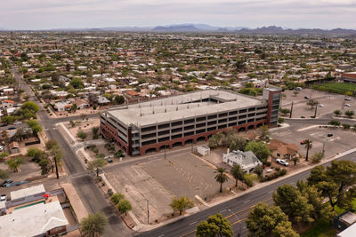 Multi-level empty parking garage and parking lot in tucson, arizona.