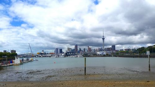 Cityscape against cloudy sky