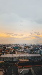 High angle view of townscape against sky during sunset