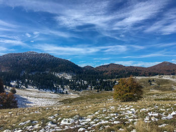 Scenic view of mountains against sky during winter