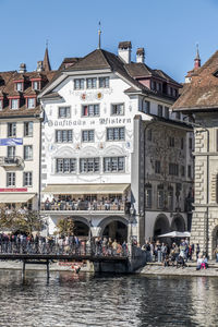 Group of people in front of buildings