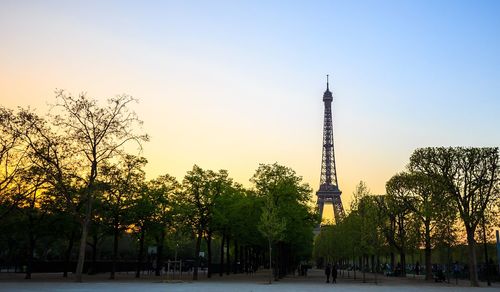 Panoramic view of trees and buildings against sky during sunset