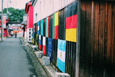 Multi colored umbrellas hanging on building