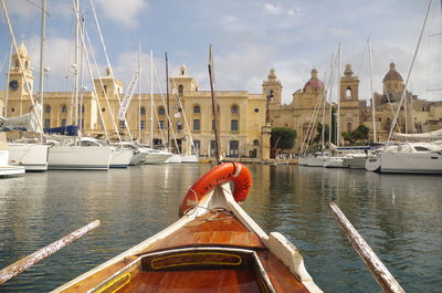 Boats in water against sky