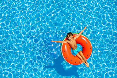 High angle view of woman swimming in pool