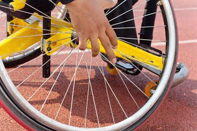 Disabled man on wheelchair at running track