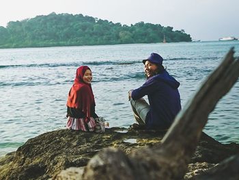 Smile couple in merak island beach