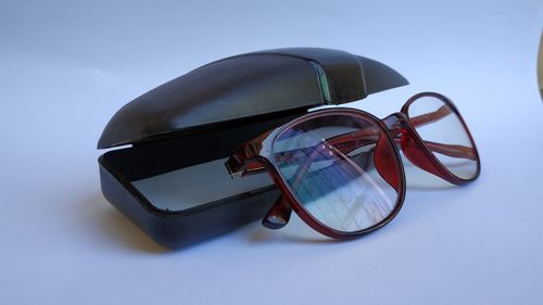 Close-up of sunglasses against white background