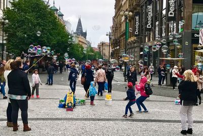 People walking on street in city