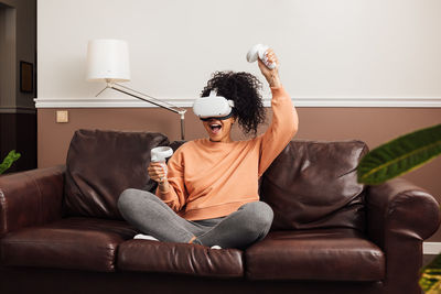 Man sitting on sofa at home