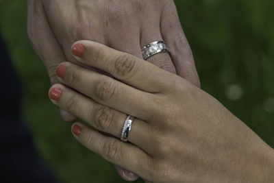 Close-up of couple holding hands