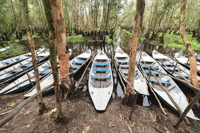 Boats moored in lake