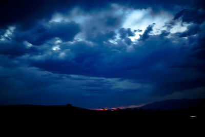 Silhouette of landscape against sky