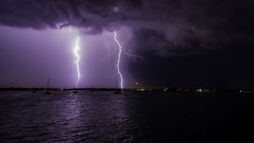 Lightning in sky over sea