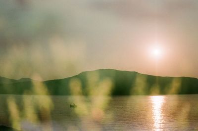 Scenic view of sunset over river