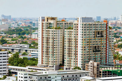 Buildings in city against sky