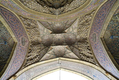 Low angle view of ornate ceiling of building