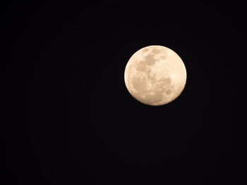 Low angle view of moon against clear sky at night